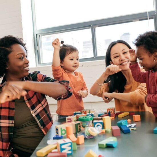 Adults playing with children